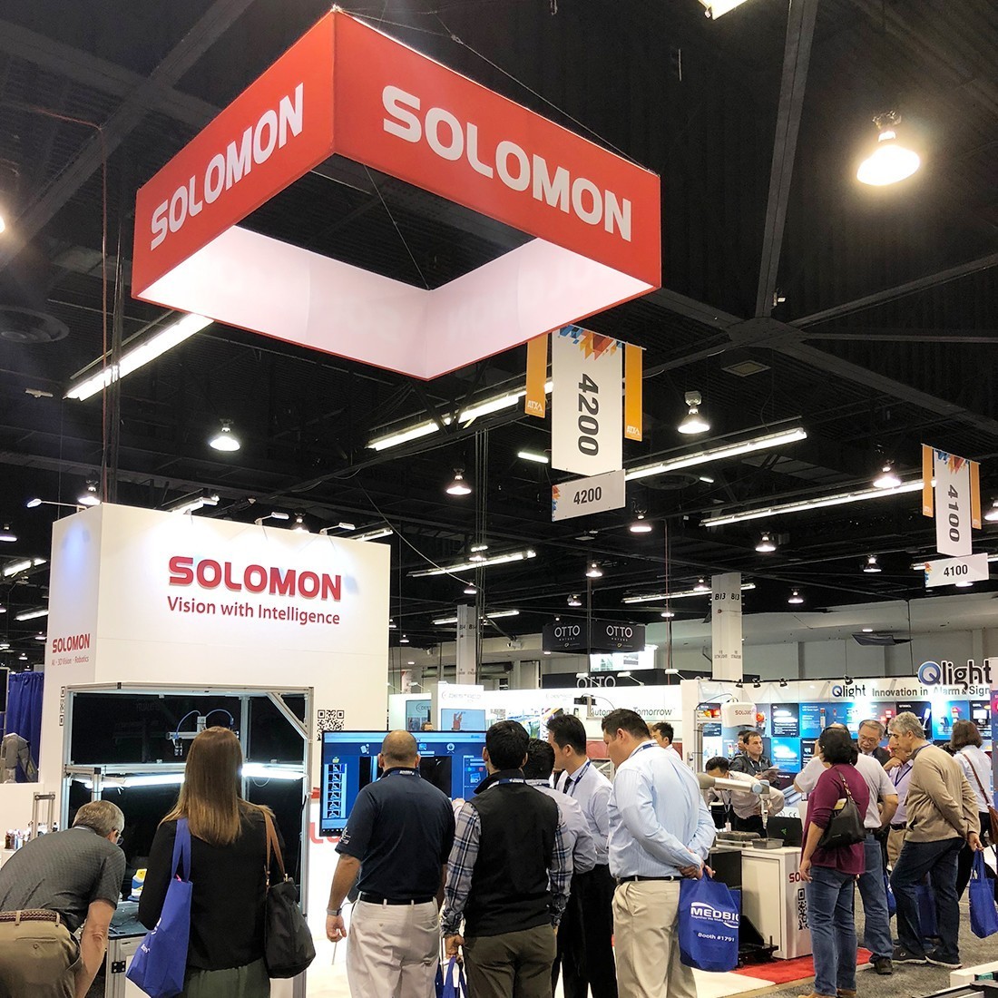 Visitors crowd around Solomon's booth at ATX West 2018