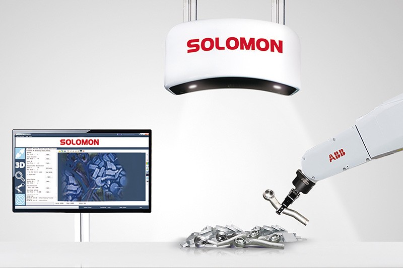 Automated bin-picking work cell featuring Solomon AccuPick AI vision software, 3D scanner, and ABB robot arm handling metal parts for smart manufacturing.