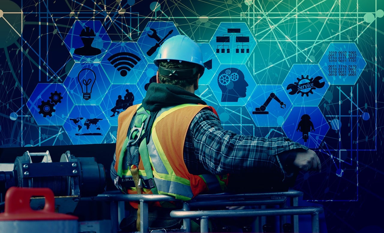 A worker in industrial protective equipment in a manufacturing environment, representing the application of industrial AI in quality control, automation, and operational safety.