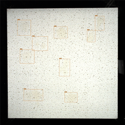 SolVision AI detects surface contamination on a drywall panel, highlighting stains and dirt marks using bounding boxes during automated inspection.