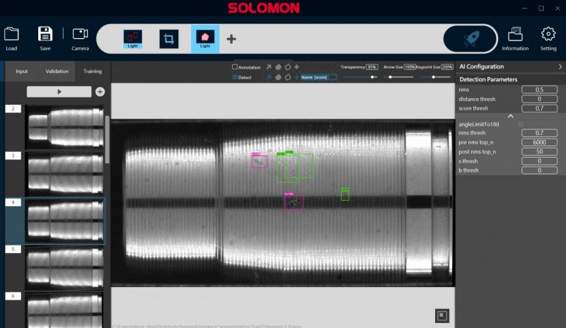 SolVision AI interface displaying precision machined component inspection with segmentation overlays highlighting detected surface defects on a metal shaft.